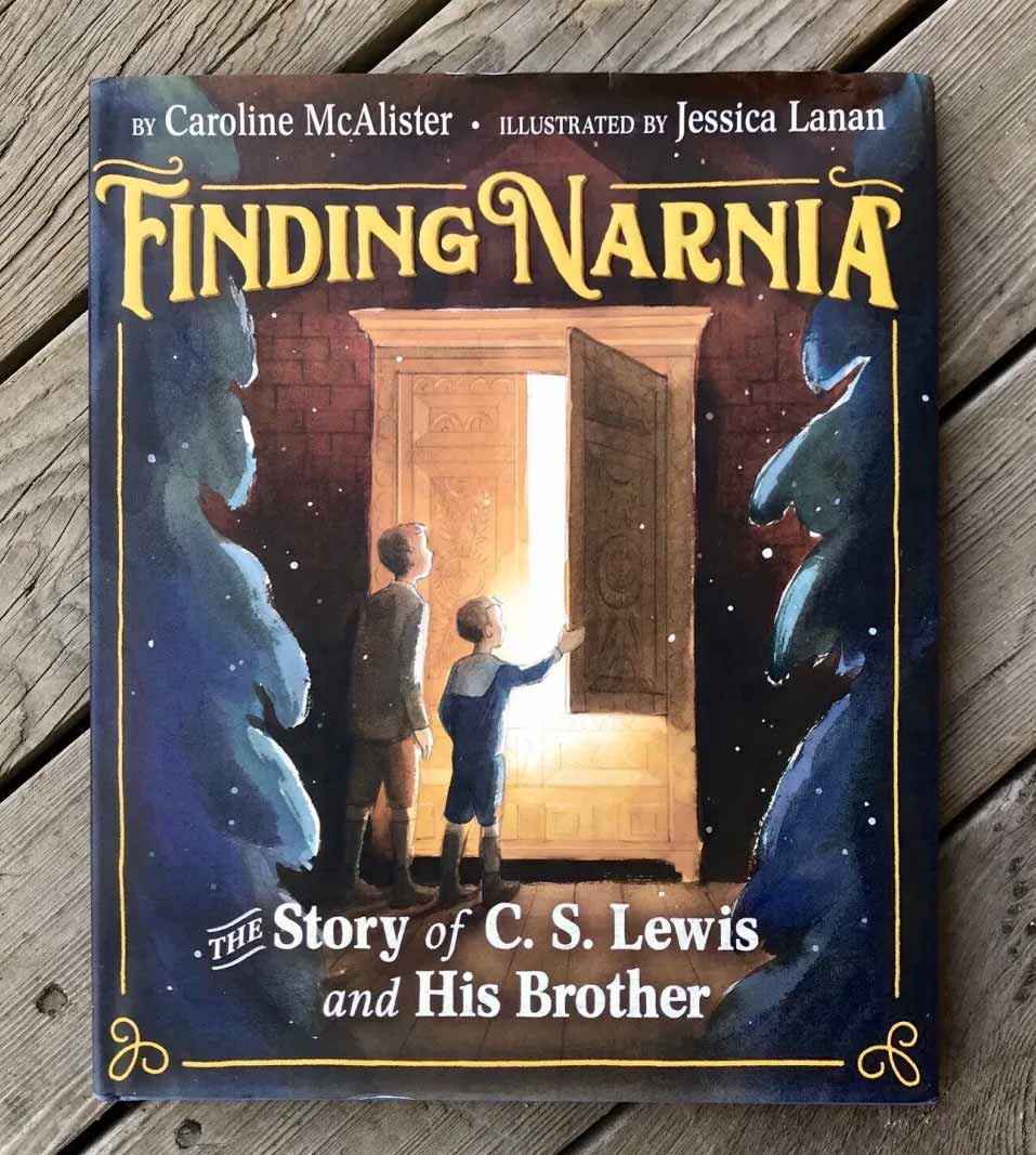 Cover image of picture book 'Finding Narnia: The Story of C.S. Lewis and his Brother' featuring two boys opening the door of a wardrobe